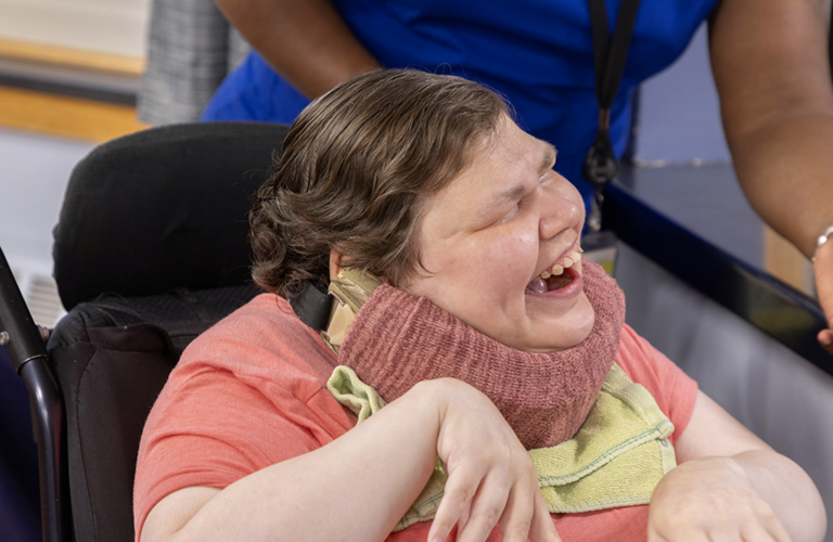 woman in wheelchair smiling
