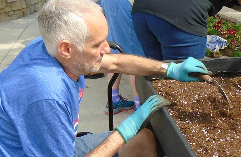 man planing in dirt