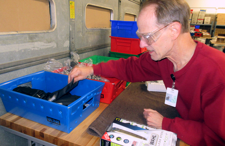 man sorting materials