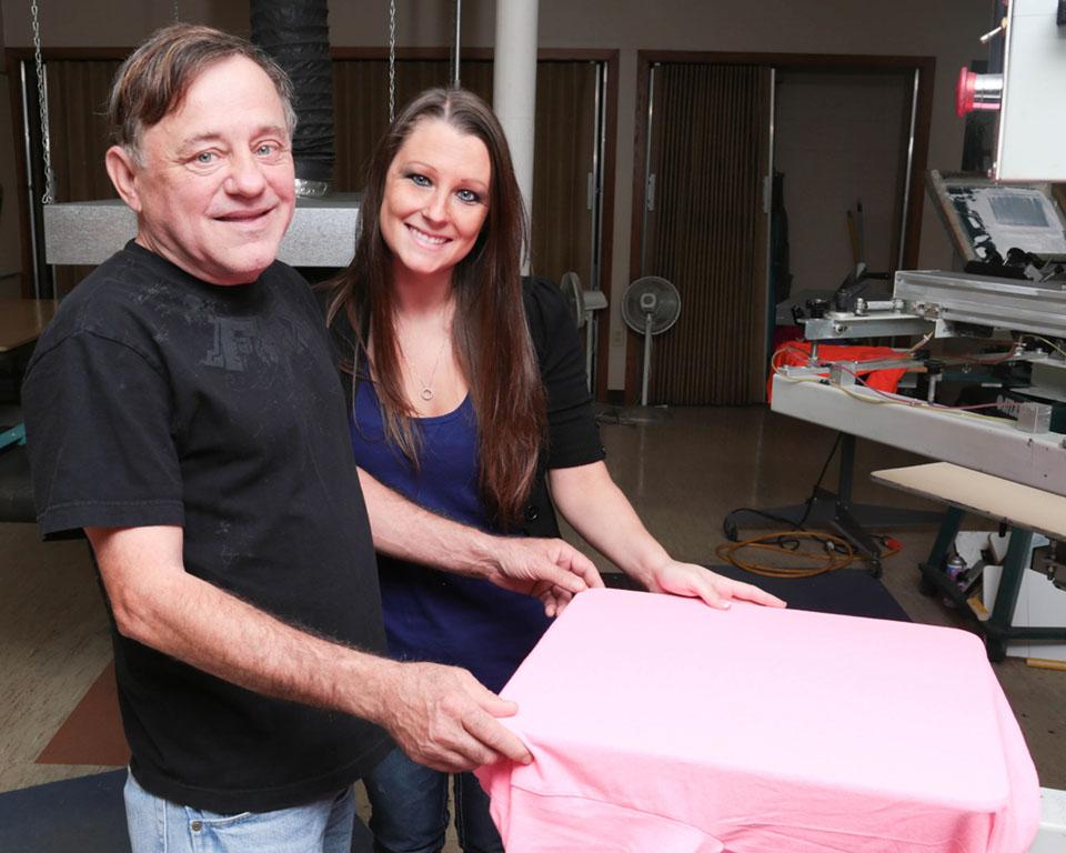 man and woman in screen print shop